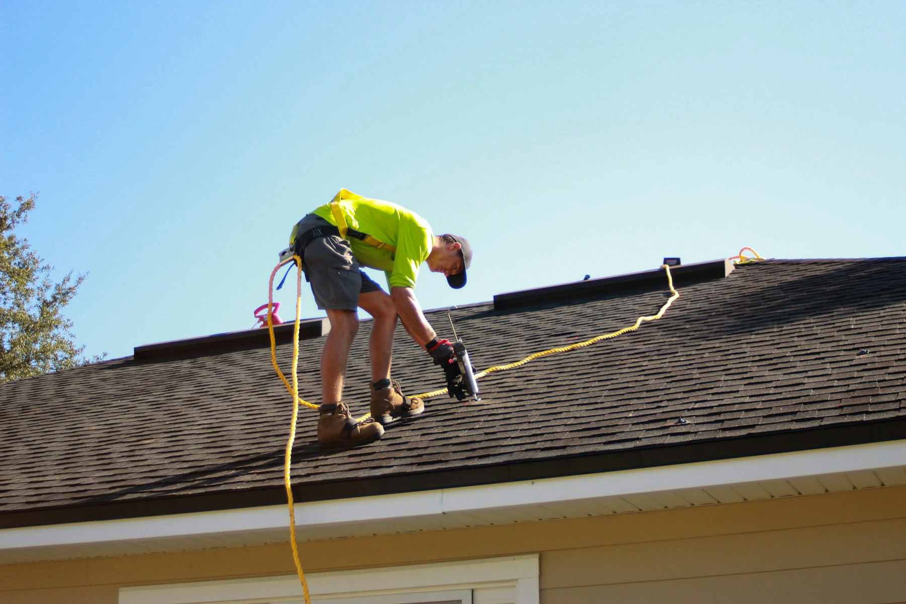 Roofing crew working on a large roof