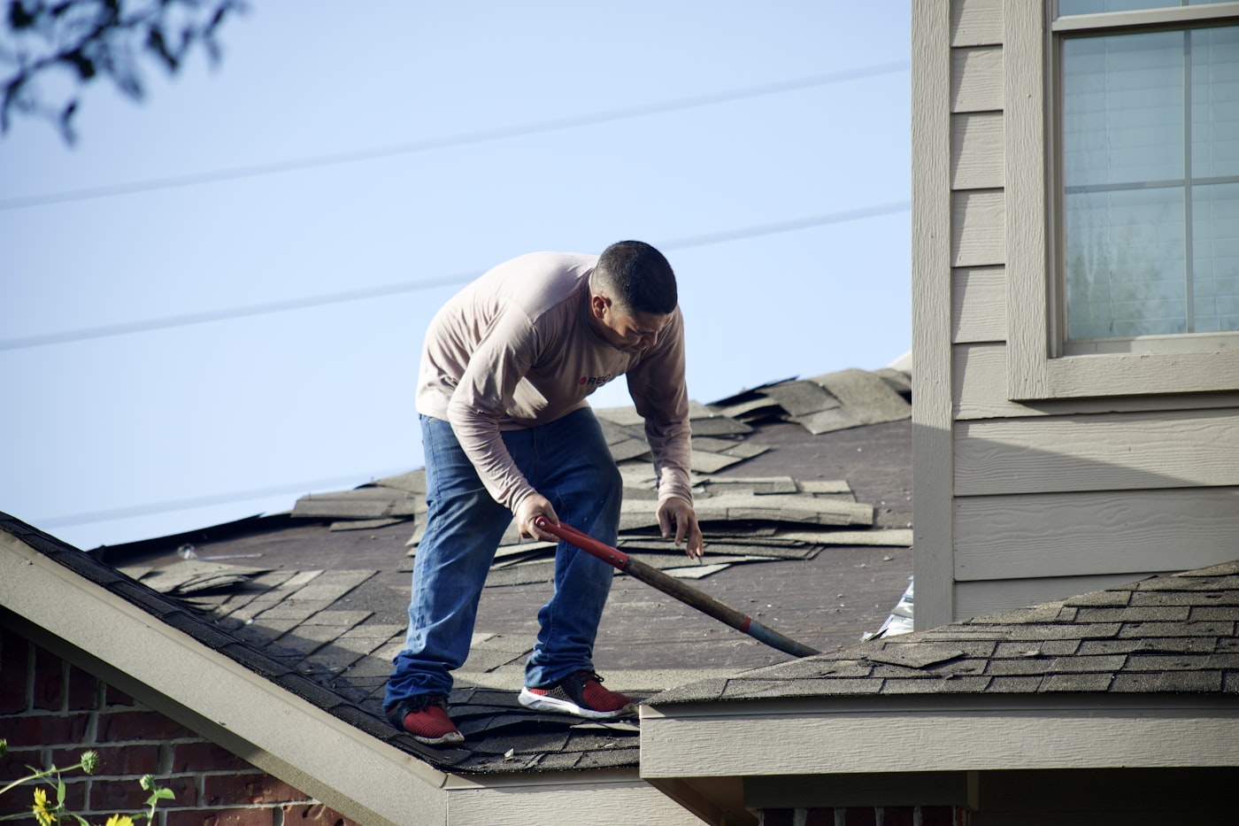 Roof repair work on a residential roof